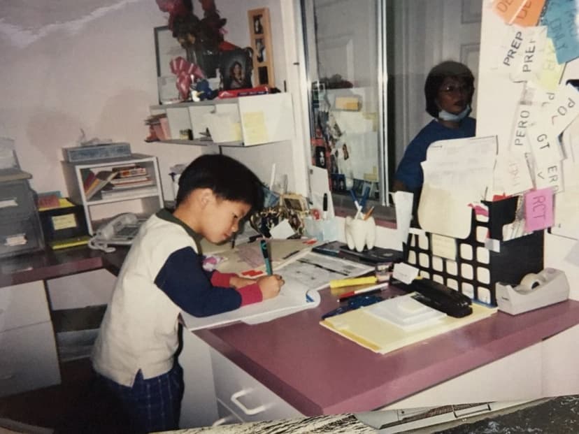 Young Dr. Mark Wang at the dental practice, where he first learned the value of honest dentistry